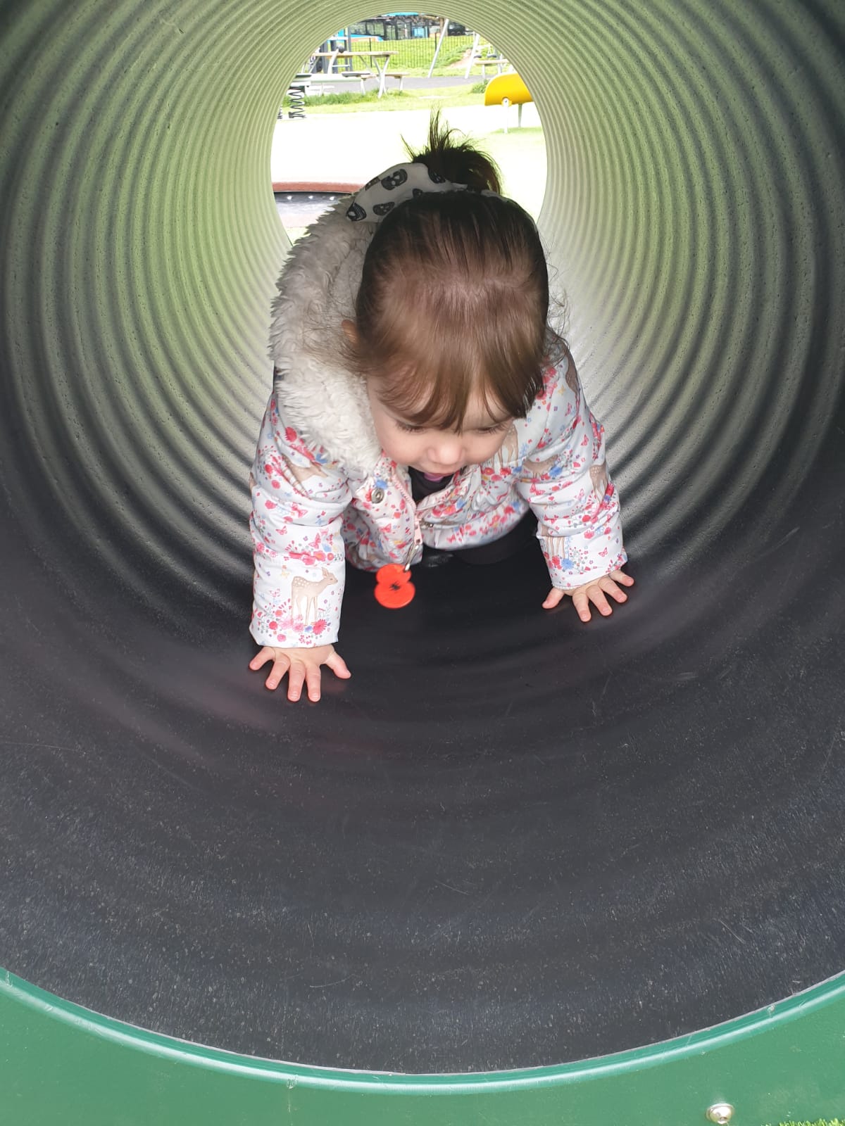 Child crawling through tunnel