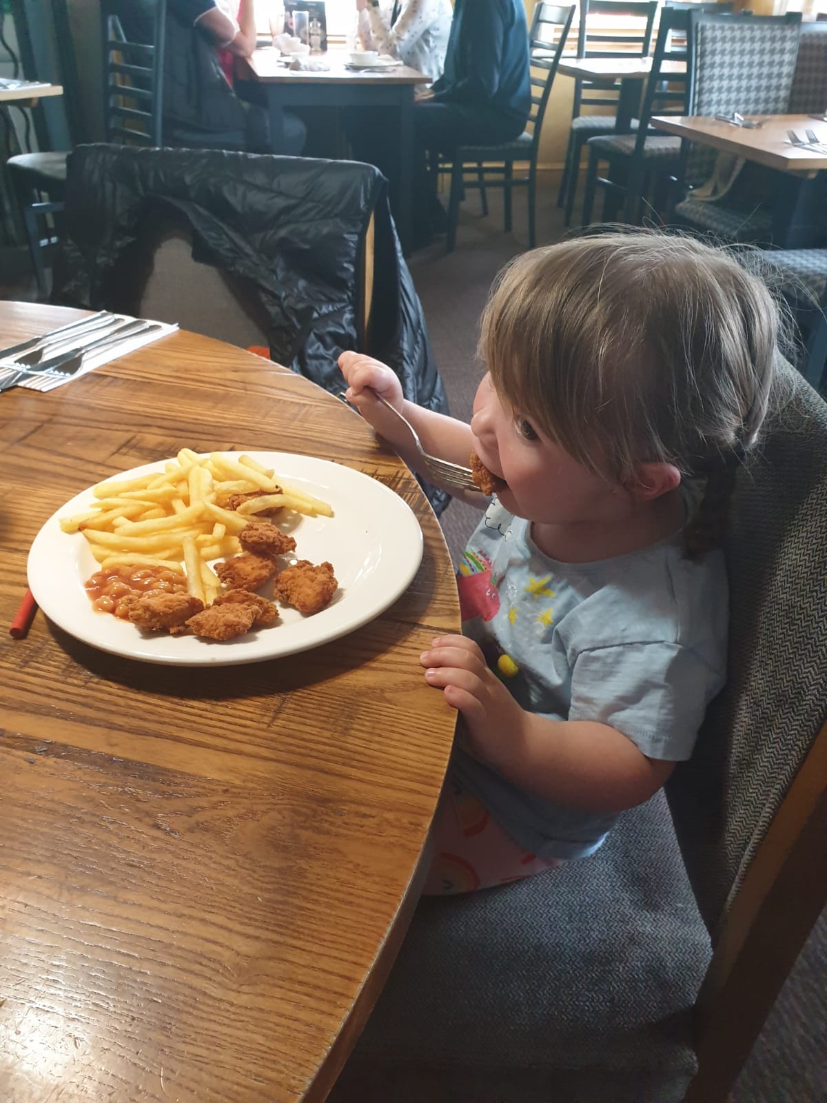 Child eating food at restaurant